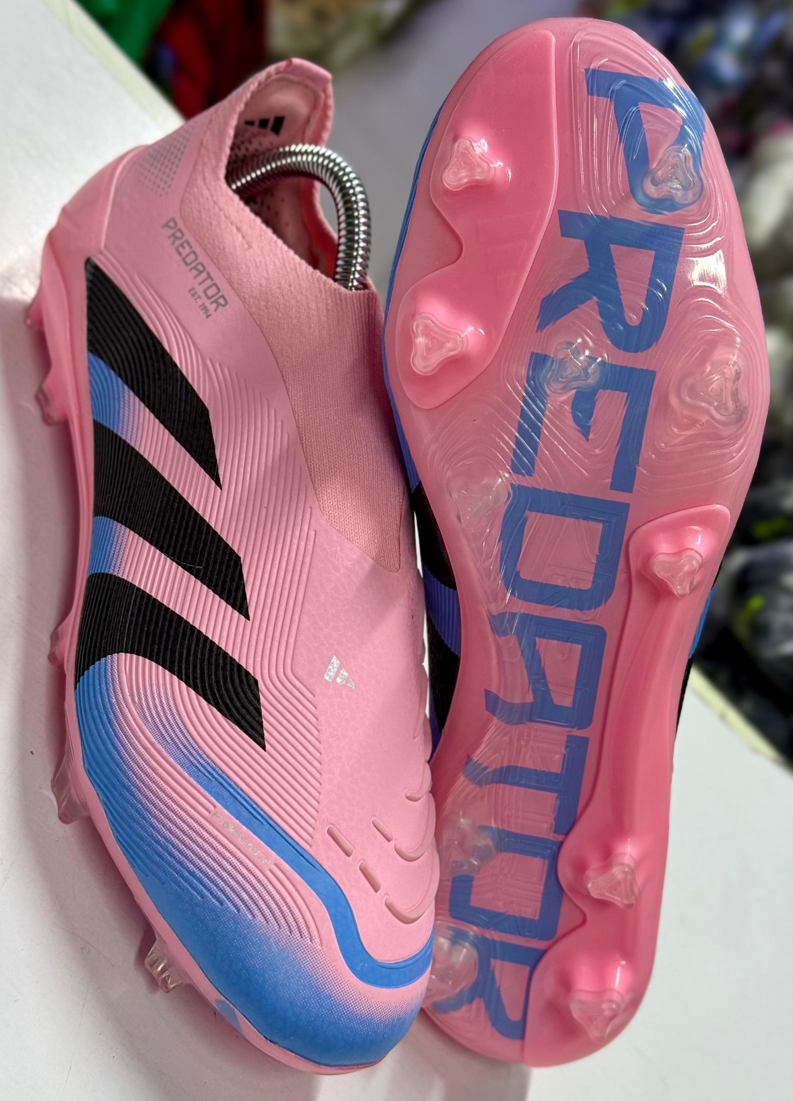 Predator Elite soccer cleats in a pink and black colorway. 
Predator Elite soccer cleats in a pink and black colorway.