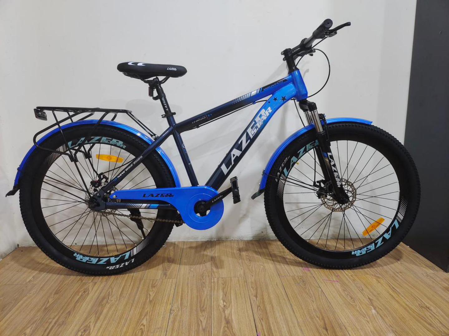 SIZE 24 LAZER ADJUSTABLE MOUNTAIN BIKE WITH A CARRIER has no gears