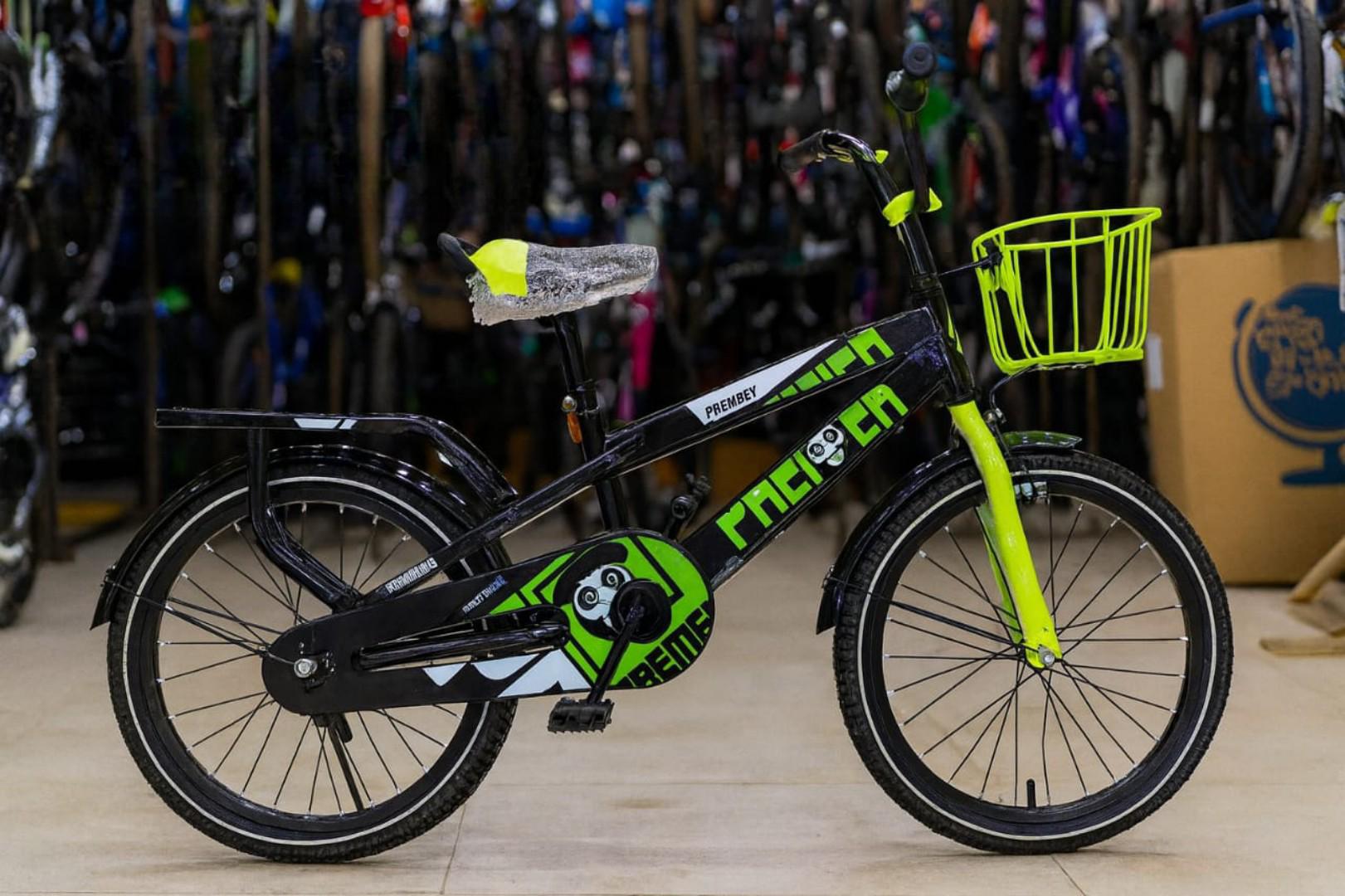 size 20 adjustable mountain bike with heavy duty carrier,a front metallic basket and brakes Age 6 to 12 years