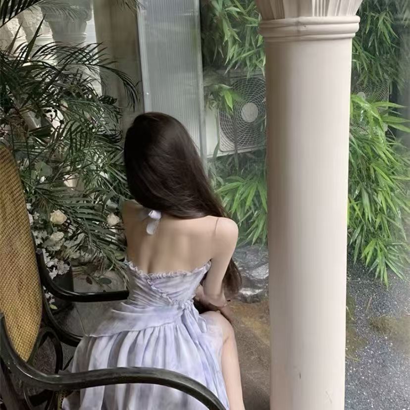 New summer French-style sleeveless dress with lotus leaf edges, featuring floral patterns, cinched waist, pure and alluring suspender design, perfect for vacations and short in length.