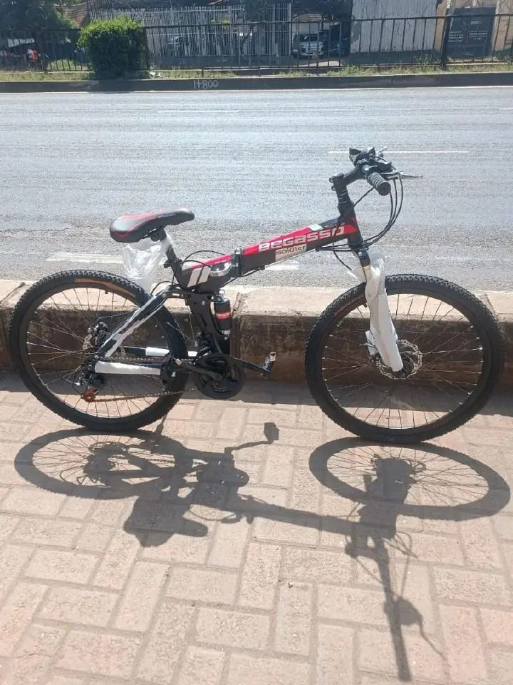 FOLDABLE MOUNTAIN BIKE BICYCLESIZE 26 WITH DISC BRAKES AND FRONT SUSPENSION AND SHIMANO GEARS
