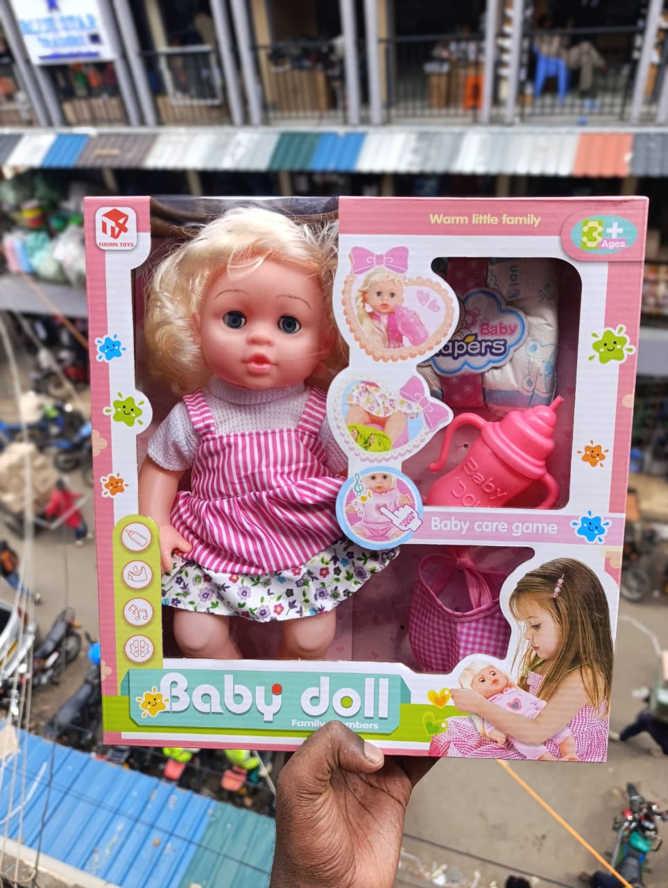 White baby doll with a care kit(feeding bottle🍼and diapers)A white baby doll with a care kit is a nurturing play toy designed to encourage imaginative role-play. The doll comes with essential baby-ca