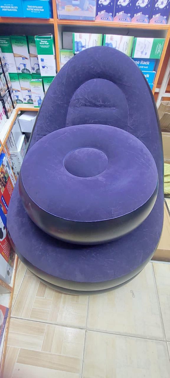 Portable inflatable air seat  with free foot rest..