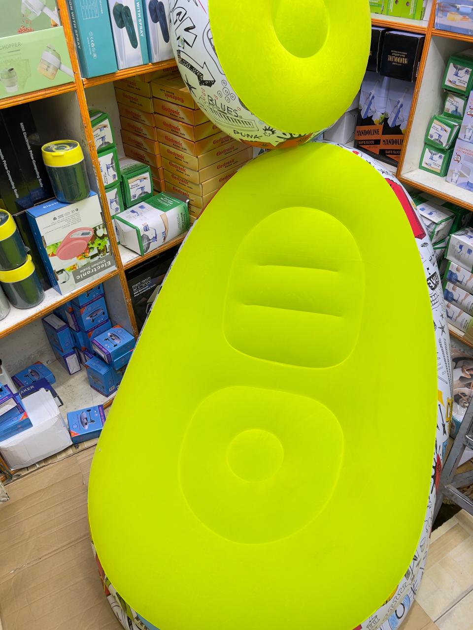 Portable inflatable air seat  with free foot rest..