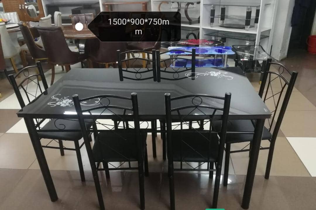 Big Executive 6 sitter dinning table Executive 6-Seater Dining Table, designed to combine elegance, durability, and comfort. The set includes a rectangular table with a light grey wood-finish top and