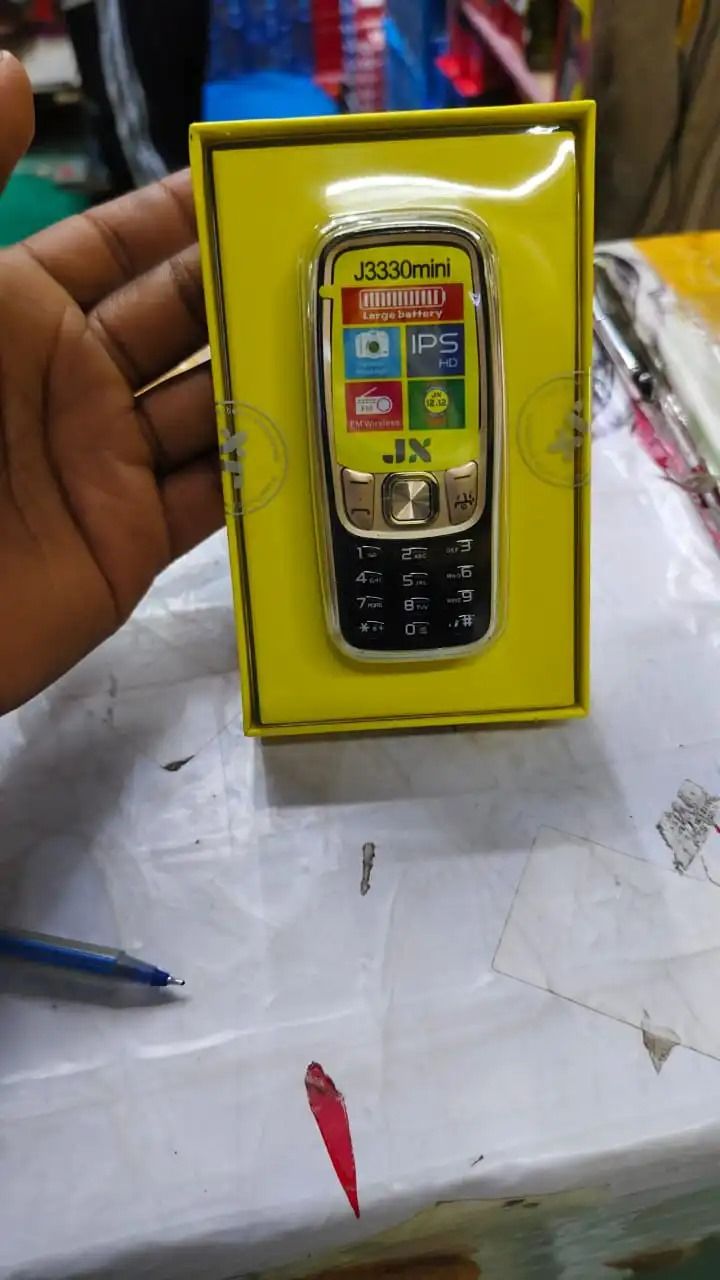 Jx J3330 mini phone 1.3" Screen Kabambe Wireless FM Camera,Bright Touch,Facebook,1000mAh Dual Sim featured phones
