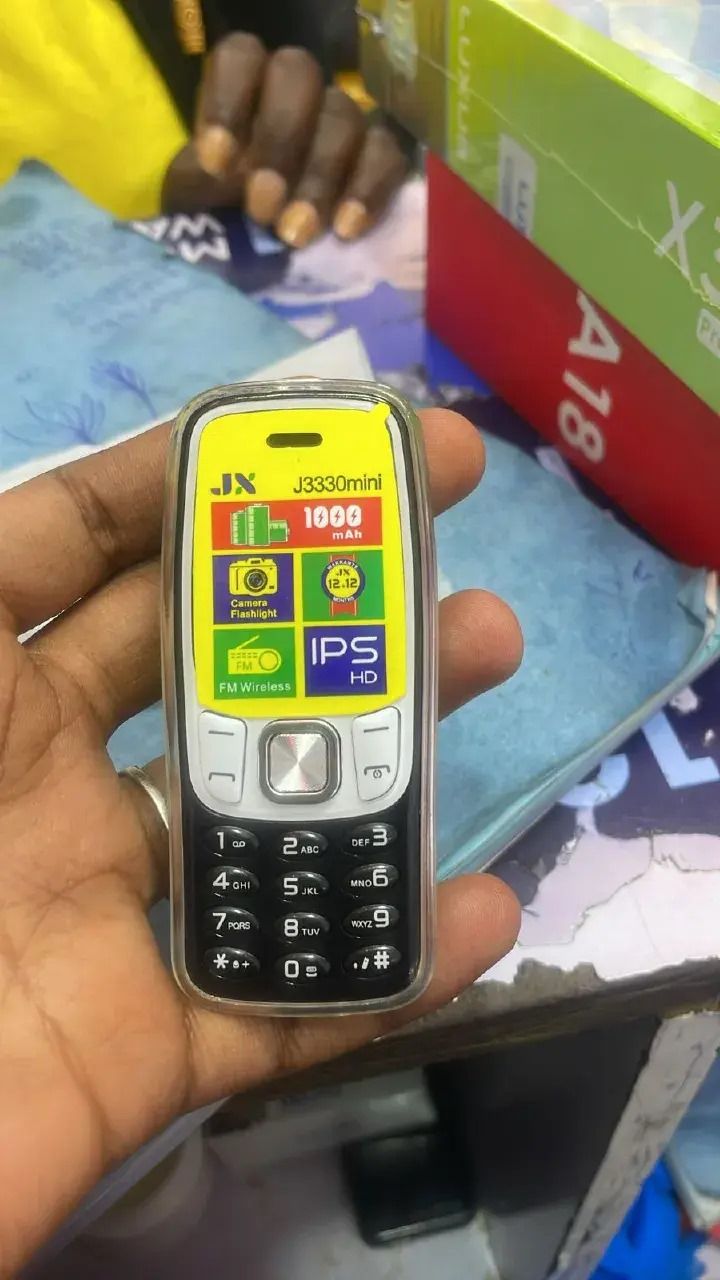 Jx J3330 mini phone 1.3" Screen Kabambe Wireless FM Camera,Bright Touch,Facebook,1000mAh Dual Sim featured phones