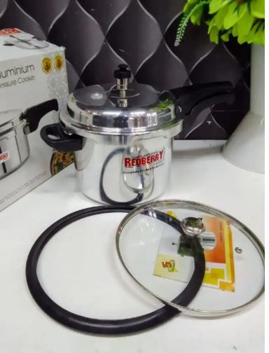 Heavy metallic aluminum kitchen pressure cooker with free glass lid.