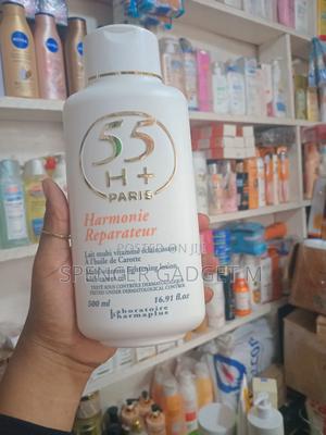 55H+ Lotion Harmonie Reparateur Multi-Vitamin Lotion16.8 Oz / 500 Ml with its unique blend of Carrot Oil and a range of multivitamins, this lotion helps to remove dark spots, hyperpigmentation