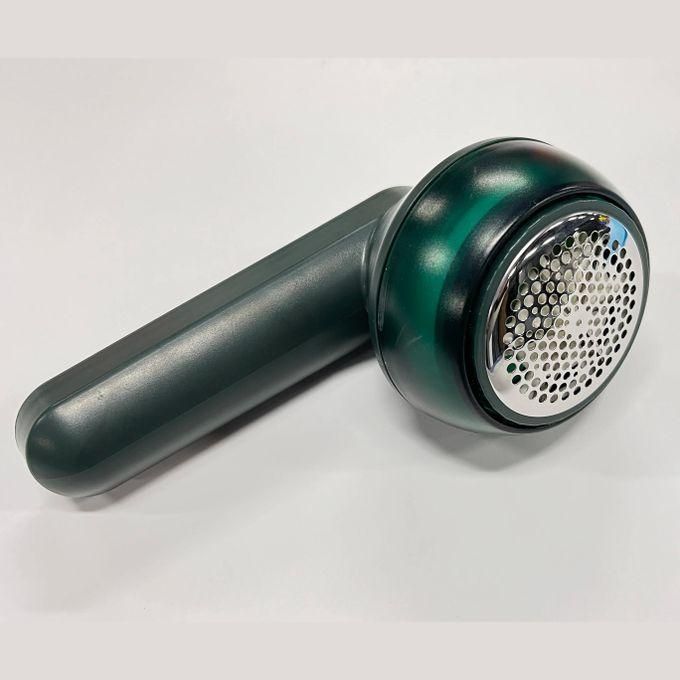 Electric Lint Remover Fabric Shaver : A compact and easy-to-use fabric shaver with rotating inner blades, designed to remove lint and fuzz from clothing efficiently.