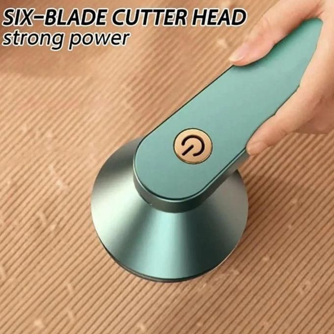 Electric Lint Remover Fabric Shaver : A compact and easy-to-use fabric shaver with rotating inner blades, designed to remove lint and fuzz from clothing efficiently.