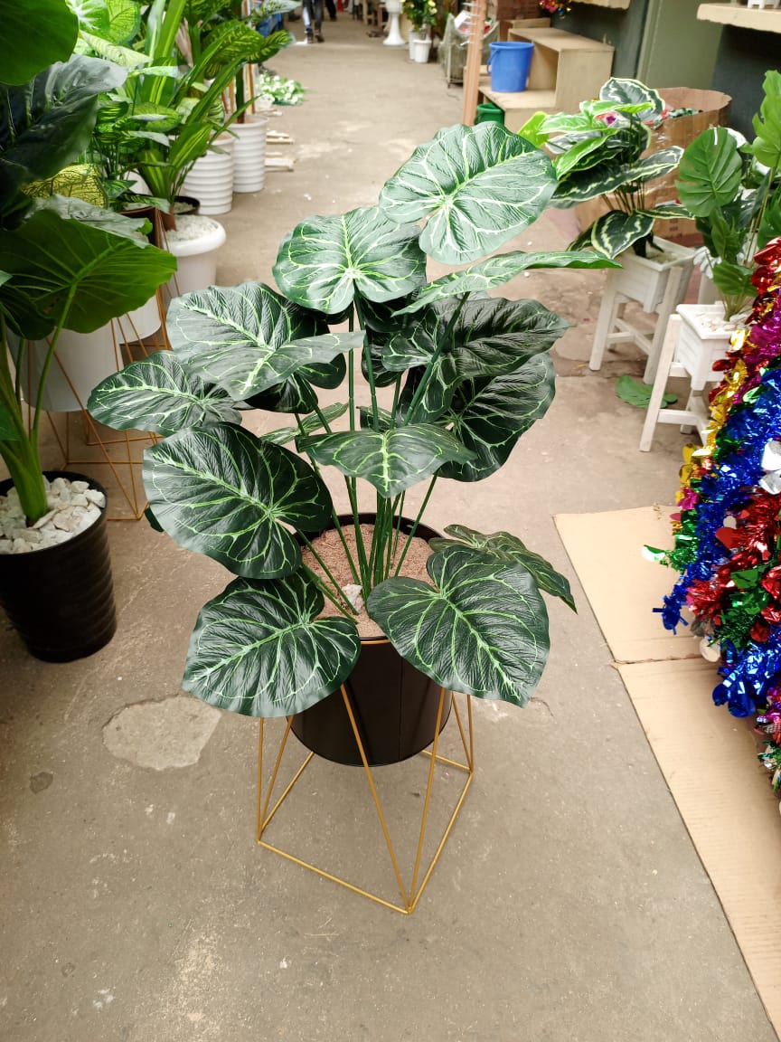 Artificial flowers with stones and vase
