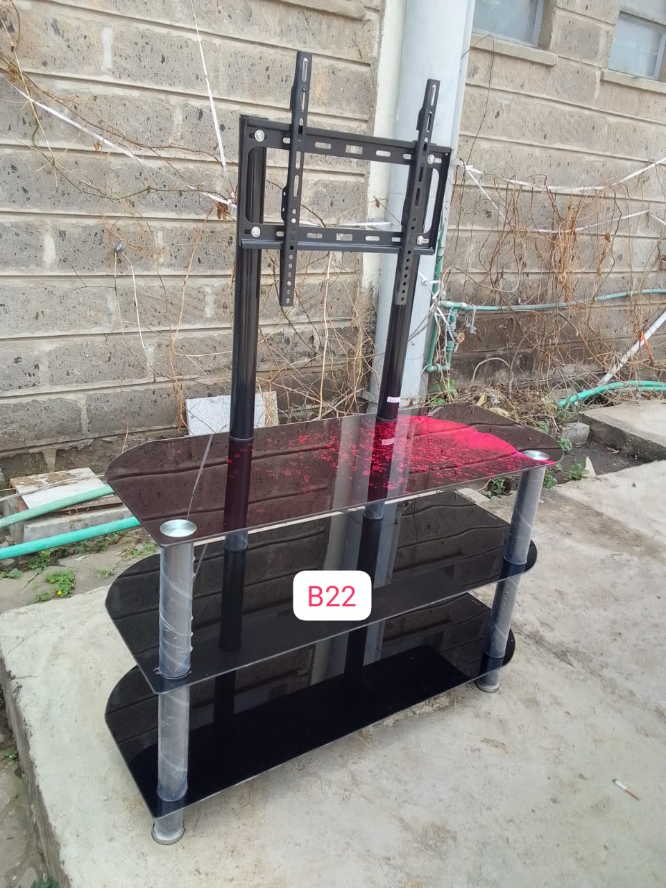 Black Executive glass  tv stand with wall mount, The tempered glass shelves provide ample storage for media devices such as gaming consoles