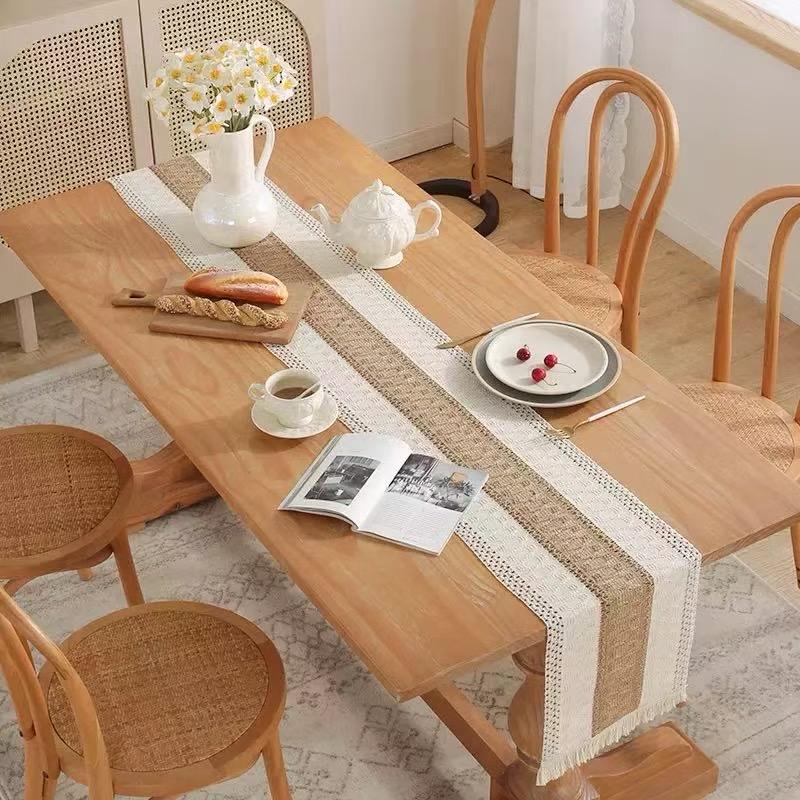 Boho splicing table runner crafted from a high-quality cotton-linen blend. Designed to bring a touch of sophistication and warmth to your dining space, it features a crisp white base adorned with deli