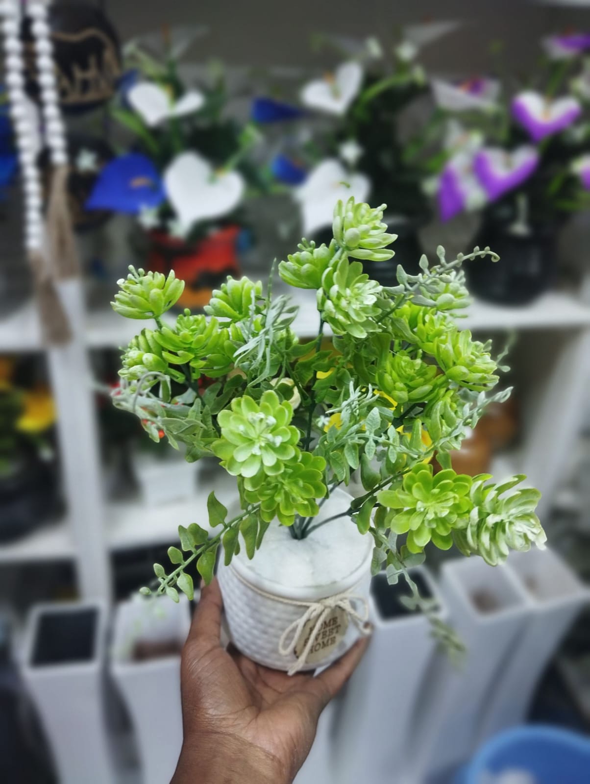 Artificial Green Plant In A White Vase