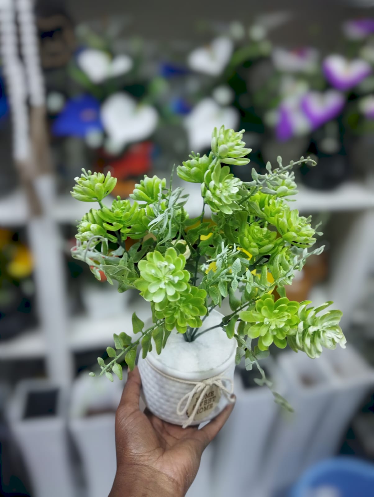 Artificial Green Plant In A White Vase
