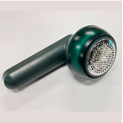 Electric Lint Remover Fabric Shaver : A compact and easy-to-use fabric shaver with rotating inner blades, designed to remove lint and fuzz from clothing efficiently.