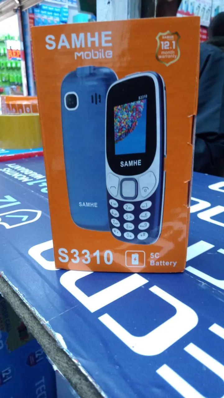 SAMHE S3310 Mobile Phone - Dual SIM, Dual Simcard, Memory Card Slot, Classic KADUDE/KABAMBE Design- Experience the perfect blend of functionality and classic design with the SAMHE S3310 Mobile Phone.
