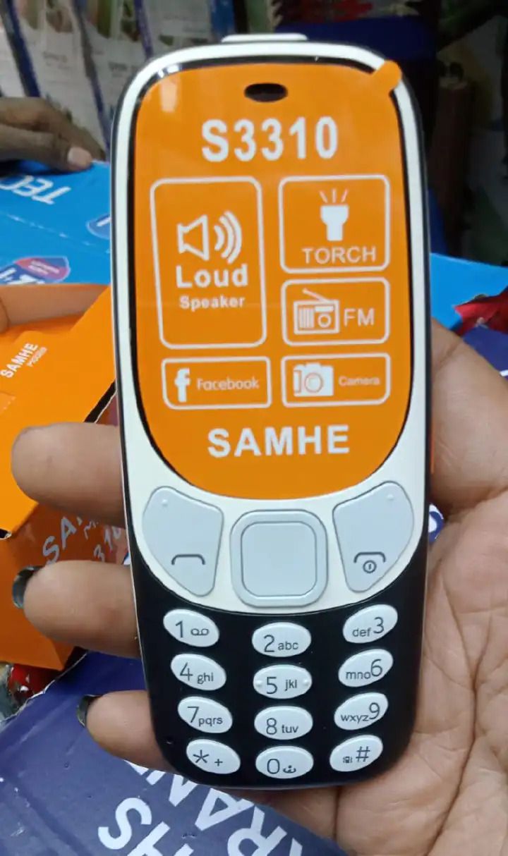 SAMHE S3310 Mobile Phone - Dual SIM, Dual Simcard, Memory Card Slot, Classic KADUDE/KABAMBE Design- Experience the perfect blend of functionality and classic design with the SAMHE S3310 Mobile Phone.