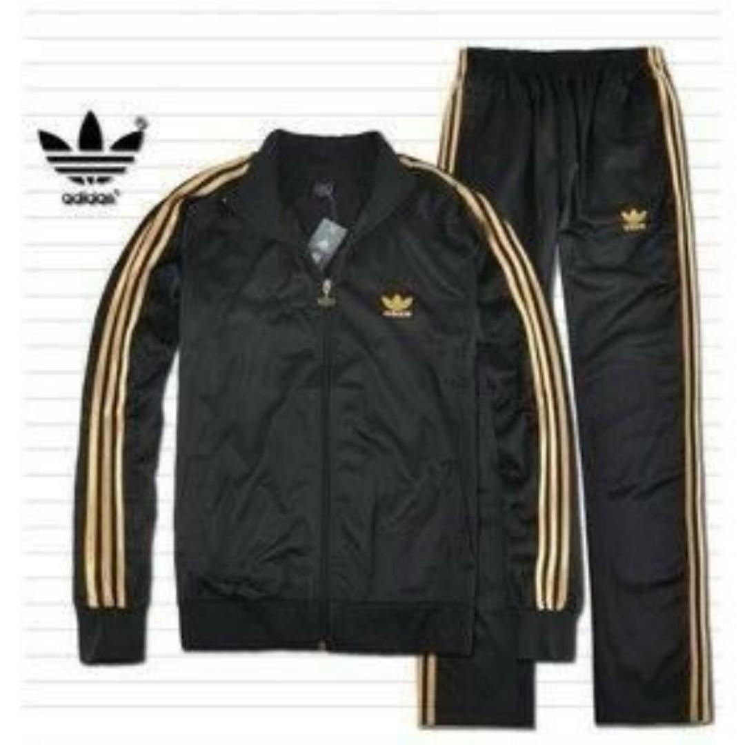ORIGINAL BLACK ADIDAS TRACKSUIT, BLACK AND GOLD STRIPES. UNISEX, HIGH QUALITY COTTON MATERIAL. WOMEN TRACKSUITS, MEN TRACKSUITS, KIDS TRACKSUITS. SPORTS TRACKSUITS