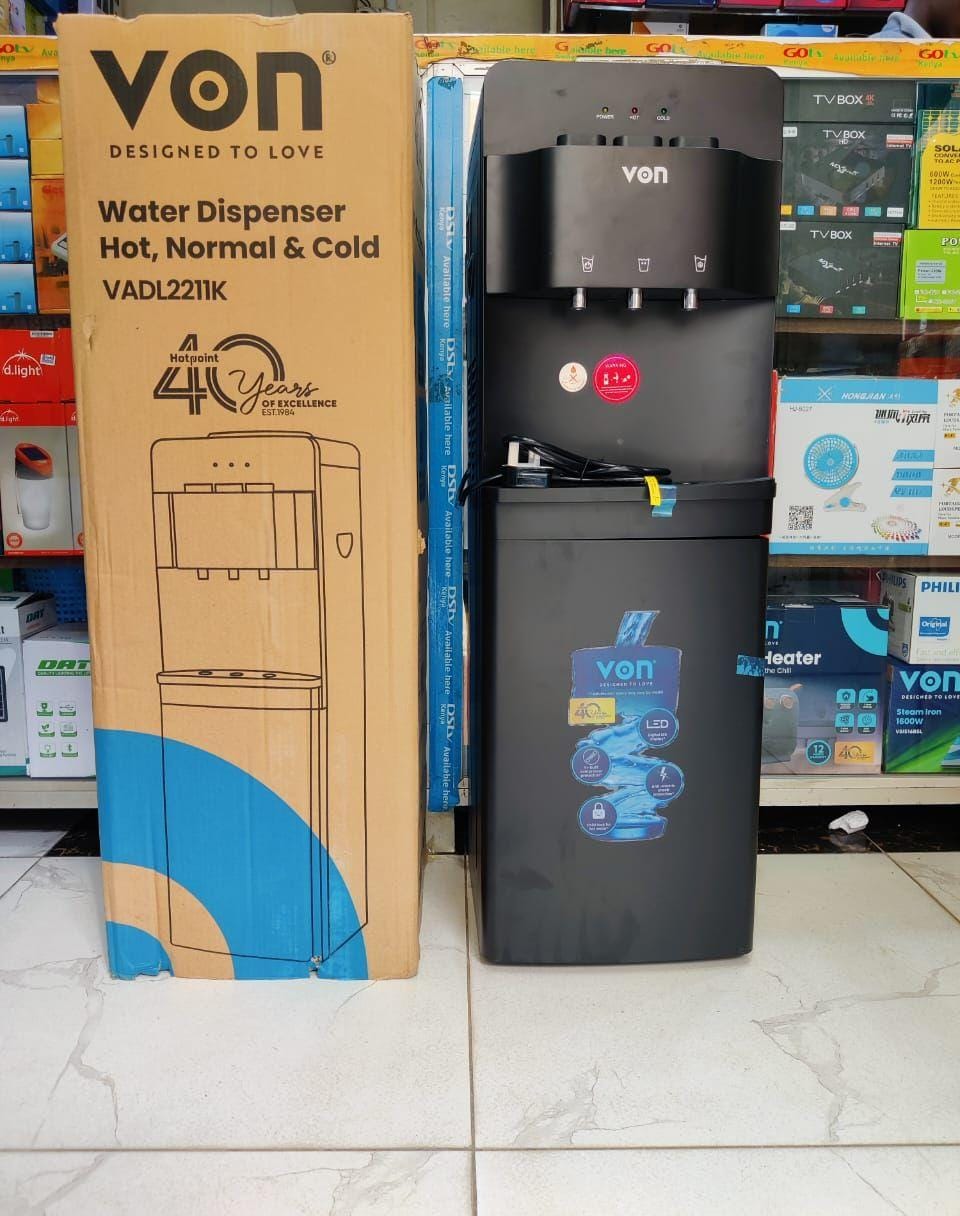 VON Black Water Dispenser 3 Taps Hot, Cold & Normal Electric Cooling With Cabinet, Push Button Child Lock Safety. The cabinet allows you to store water glasses for easy accessibility.