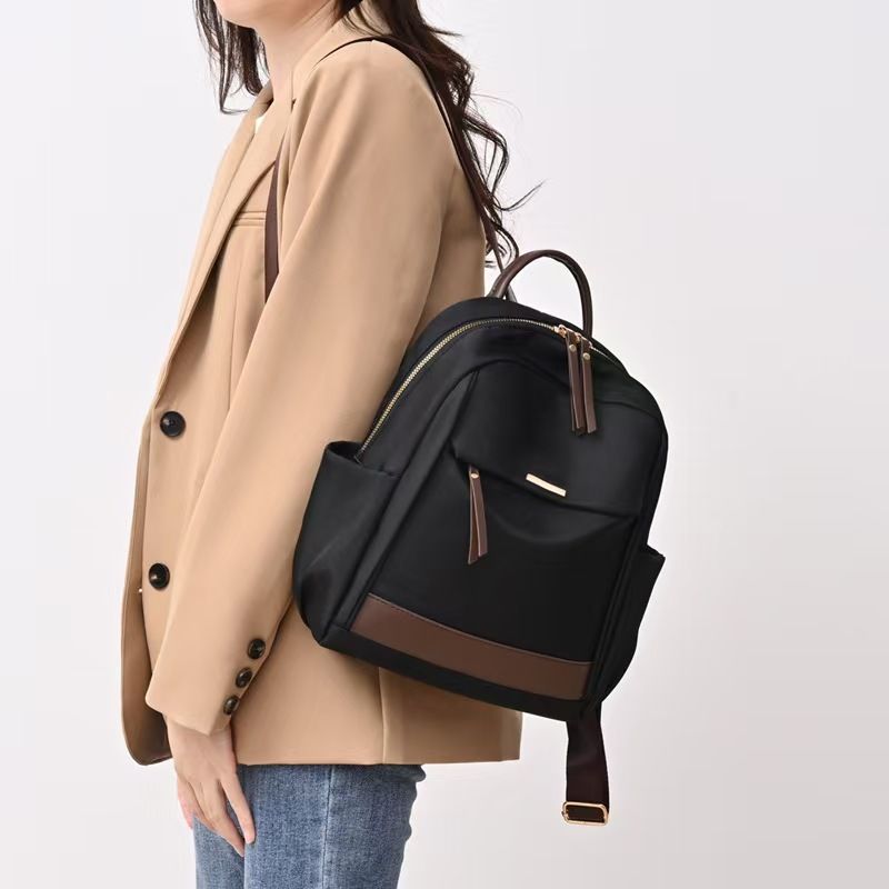 The New Ladies' Double-shoulder Bag Is A Large-capacity, Lightweight, Casual Travel Backpack Made Of Nylon, Featuring A Simple Design Suitable For Commuting And Studying. It Has The Top Quality Among