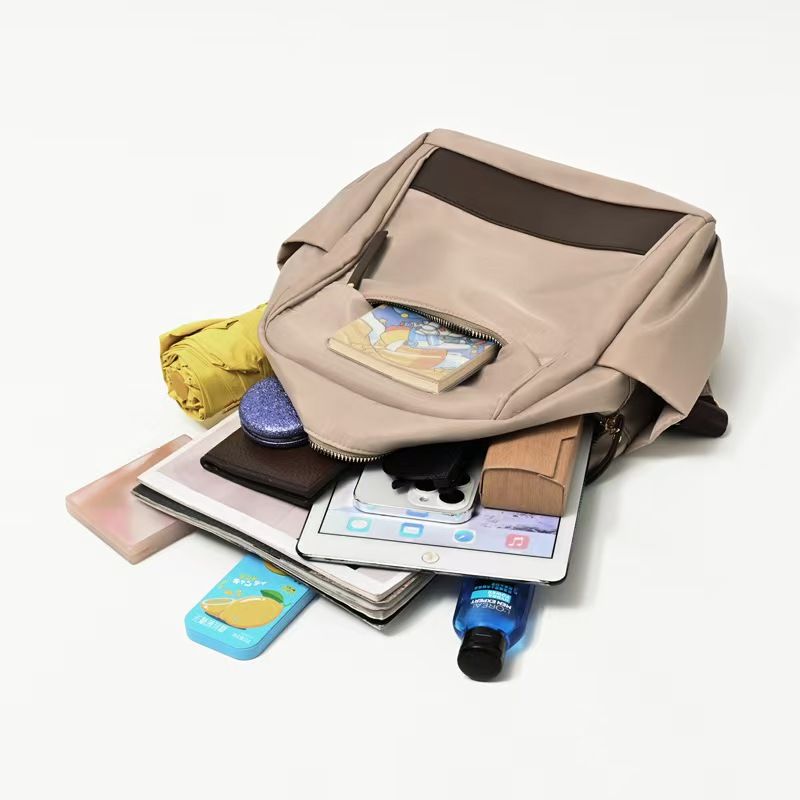 The New Ladies' Double-shoulder Bag Is A Large-capacity, Lightweight, Casual Travel Backpack Made Of Nylon, Featuring A Simple Design Suitable For Commuting And Studying. It Has The Top Quality Among