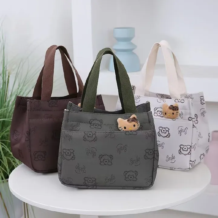 The New Cartoon-printed Handbag Is A Large-capacity Shoulder Bag, Trendy And Fashionable. It Is Also A Briefcase for Office Workers. It Is The Top-Quality Product On The Entire Online Market.