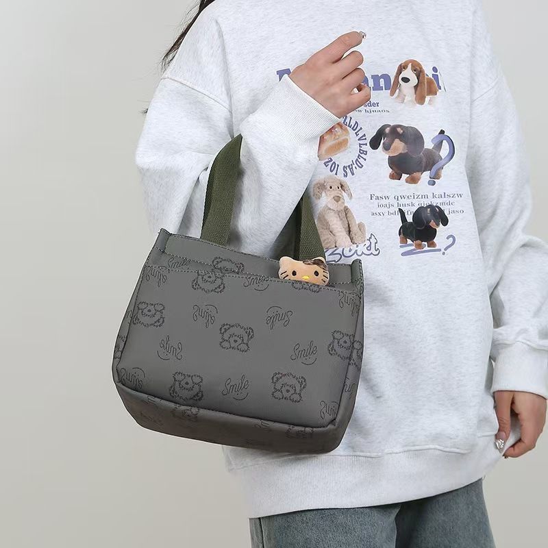 The New Cartoon-printed Handbag Is A Large-capacity Shoulder Bag, Trendy And Fashionable. It Is Also A Briefcase for Office Workers. It Is The Top-Quality Product On The Entire Online Market.