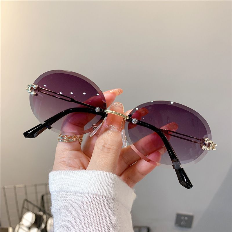 2025 New sunglasses Ladies oval net red gradient dark glasses personality rimless cut edge trend glasses