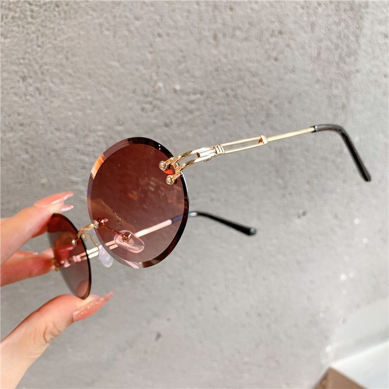 2025 New sunglasses Ladies oval net red gradient dark glasses personality rimless cut edge trend glasses