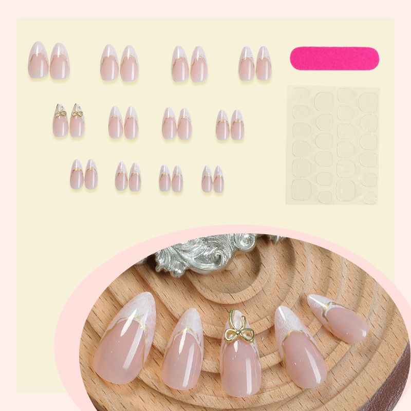 A detachable and wearable nail plate set for ladies with exquisite French bow, almond gold edge lines and delicate nail art