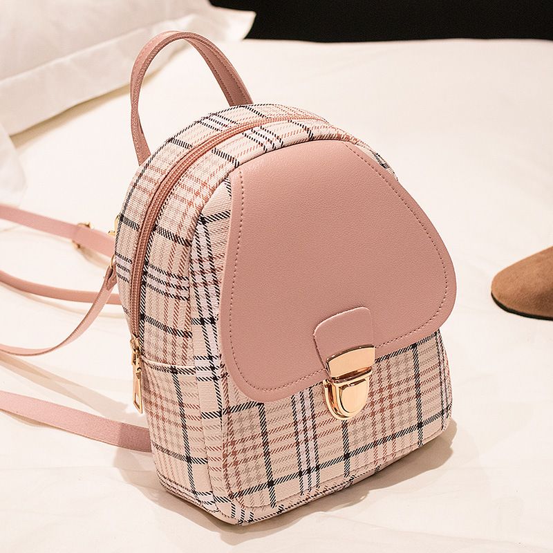 The new checkered backpack is a trendy Korean-style bag. It's a small hand-held bag with a lock and a single-shoulder crossbody bag for students. It's fashionable and versatile