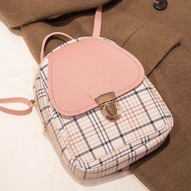 The new checkered backpack is a trendy Korean-style bag. It's a small hand-held bag with a lock and a single-shoulder crossbody bag for students. It's fashionable and versatile