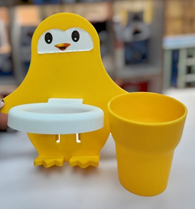 PENGUIN TOOTHPASTE AND TOOTHBRUSH HOLDER WITH CUP, STICKS WITH ADHESIVE STICKER A delightful penguin design that appeals to both children and adults