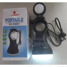 KC Rechargeable Torch – Multi-Functional Solar-Powered LED Light with Dual Spotlight and Lamp Modes, Ultra-Bright Illumination, Compact Design, and Durable Build for Indoor and Outdoor Use.