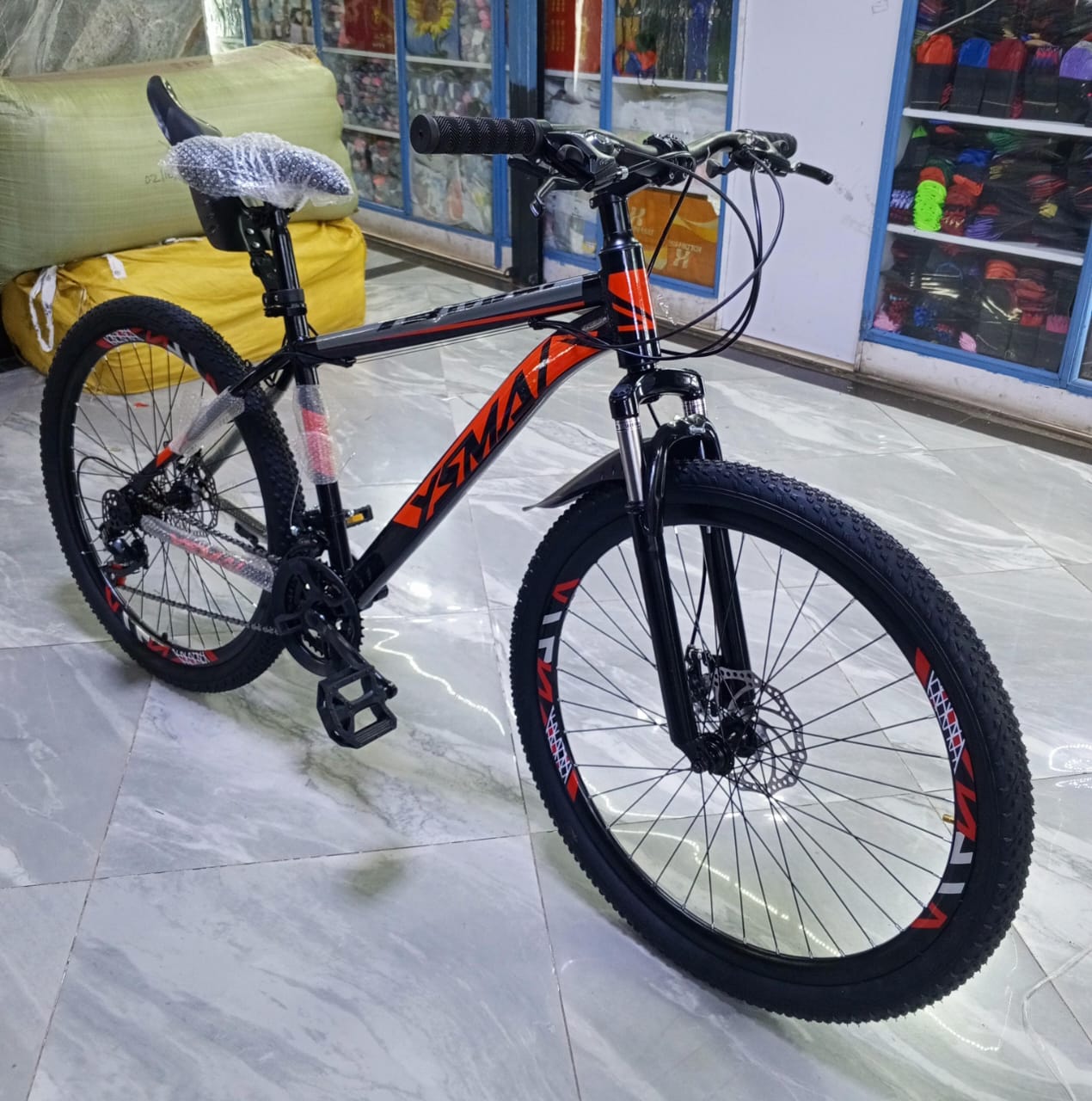 Quality size 26 adult bike  with frame  made of lightweight,  rust resistant aluminum alloy and fork have a suspension system, and the wheels are fitted with disc brakes.