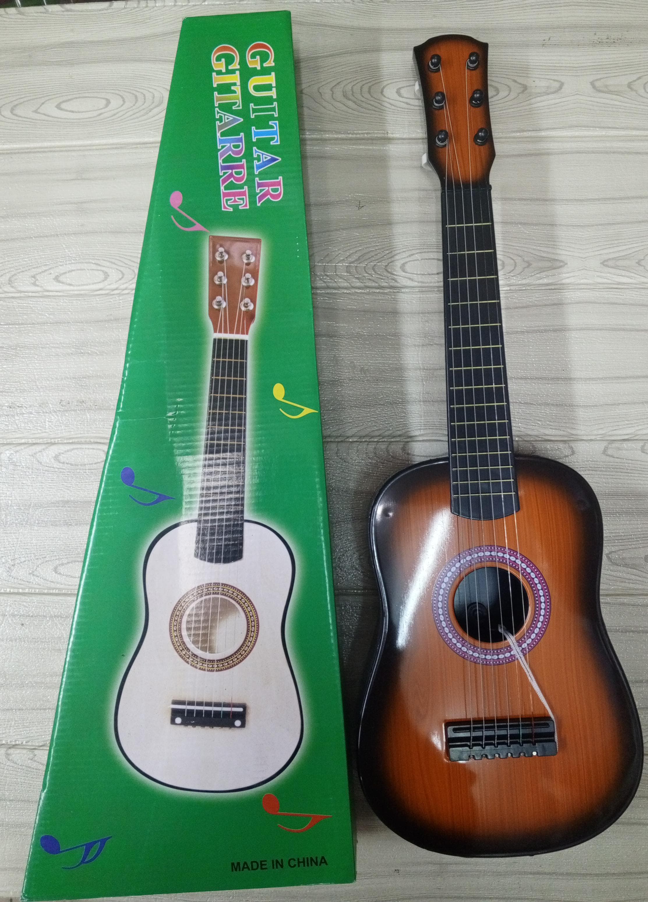 🤑🥑**HOT DEALS 🔥 🥑🌽ONLY AT KILIMALL !!! **🥑1Pc Brand New Very Quality & Stylish Kids ➡️ Musical guitar ➡️ 6 strings➡️ Size 23 inch..At Affordable Price