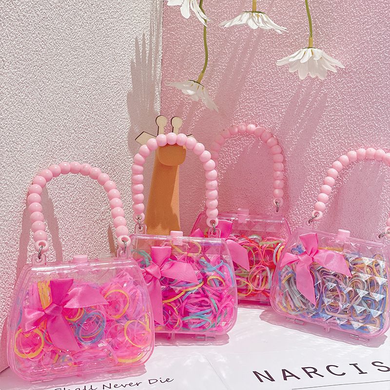Hot selling candy colored hair loop, cute girl heart pink handbag disposable hair rope, personalized rubber bands for children's hair accessories, no harm to hair small rubber bands