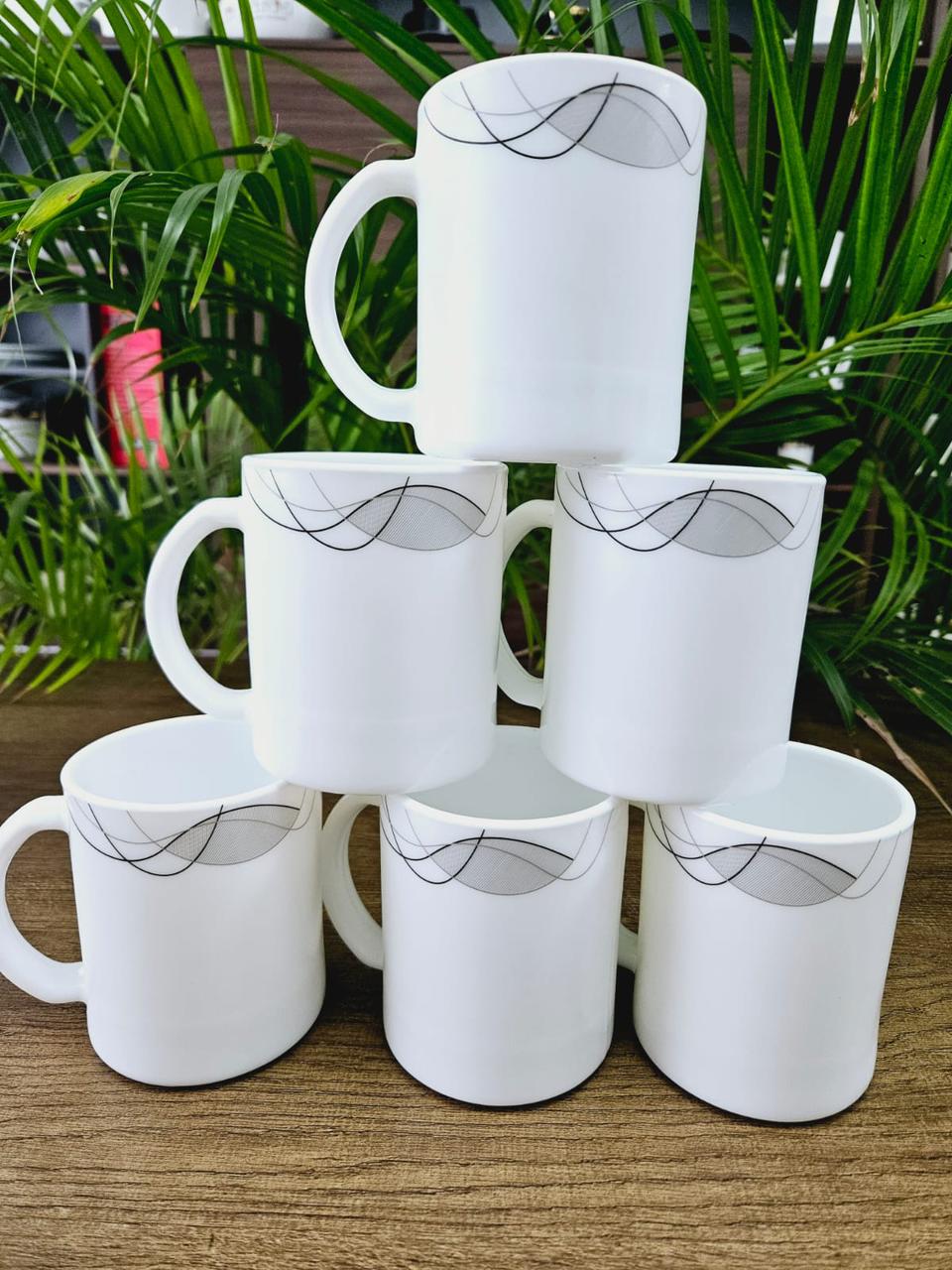 ☕✨ PureWhite Elegance Ceramic Mug Set (6-Piece) | Modern Prints • Durable • Everyday Luxury ✨☕ Bring calm, class, and character to every sip with this Premium White Ceramic Mug Set, featuring three e