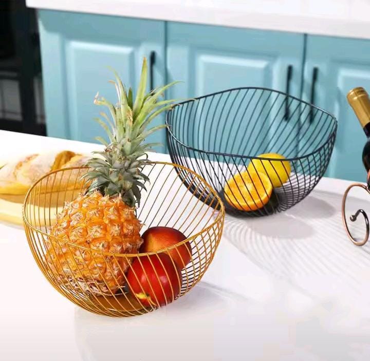 Oval Decorative Fruit Basket A stylish metallic oval fruit basket designed to keep your fruits organized and beautifully displayed. Made from durable metal, it adds a modern touch to your kitchen or d
