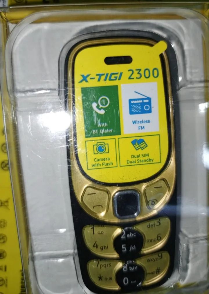 X TIGI tiny phone 2300 dual sim wireless FM radio with bluetooth featured phone
