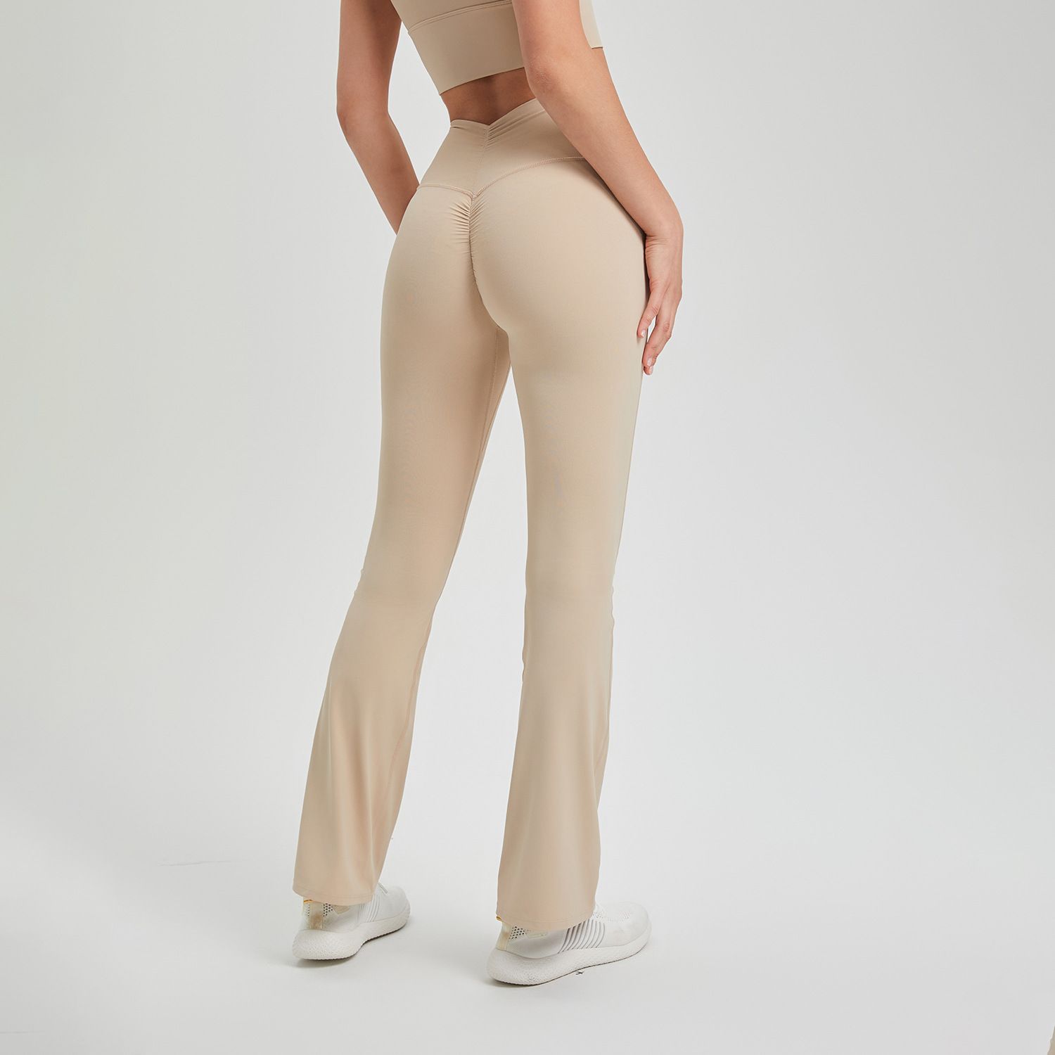 New high waisted pleated buttocks lifting pants, anti roll edge nude yoga pants, running and sports pants for external wear, breathable fitness bell pants, suitable for sports, yoga, Pilates, daily we