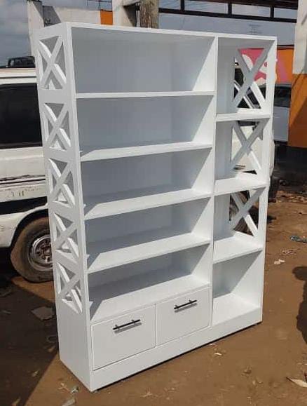 Modern shelf with multiple shelfs and drawers.