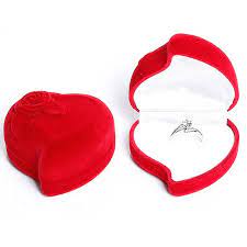 A red velvet heart shaped ring box