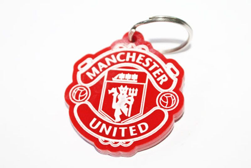 A Red Manchester United key holder is a product typically associated with the English football club, Manchester United.