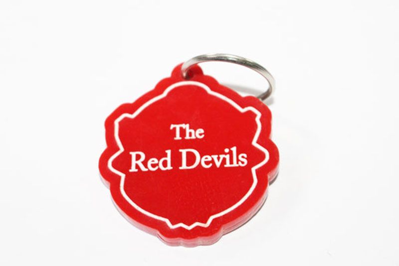 A Red Manchester United key holder is a product typically associated with the English football club, Manchester United.