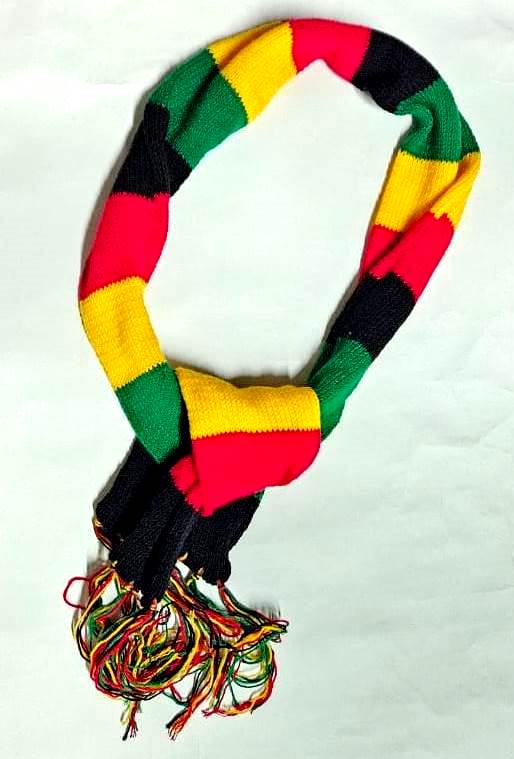 vibrant multicolor hand-knit scarf is a cozy and stylish accessory Crafted with care and attention to detail