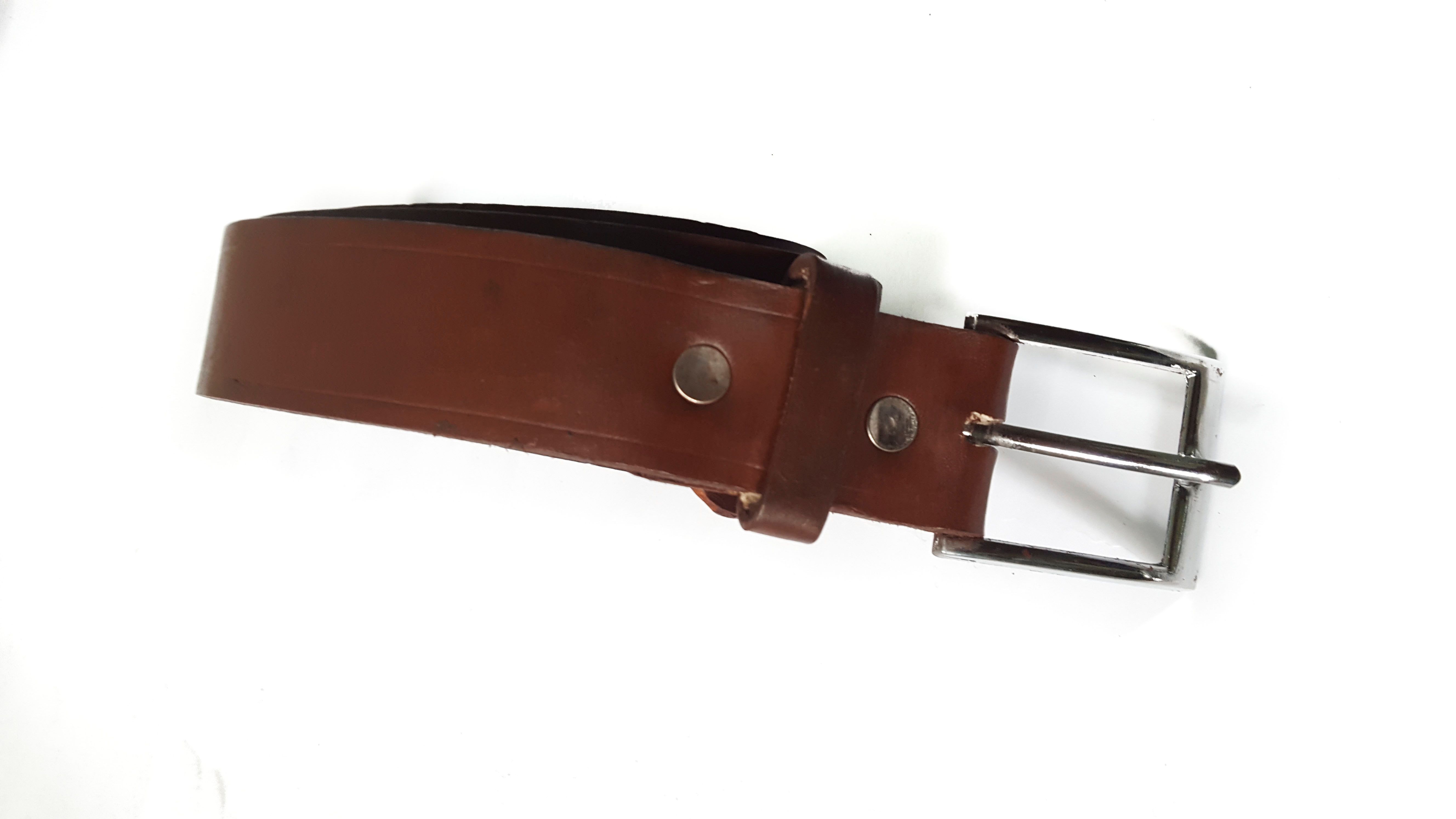 Classic Brown Leather Belt, a testament to timeless elegance and craftsmanship.