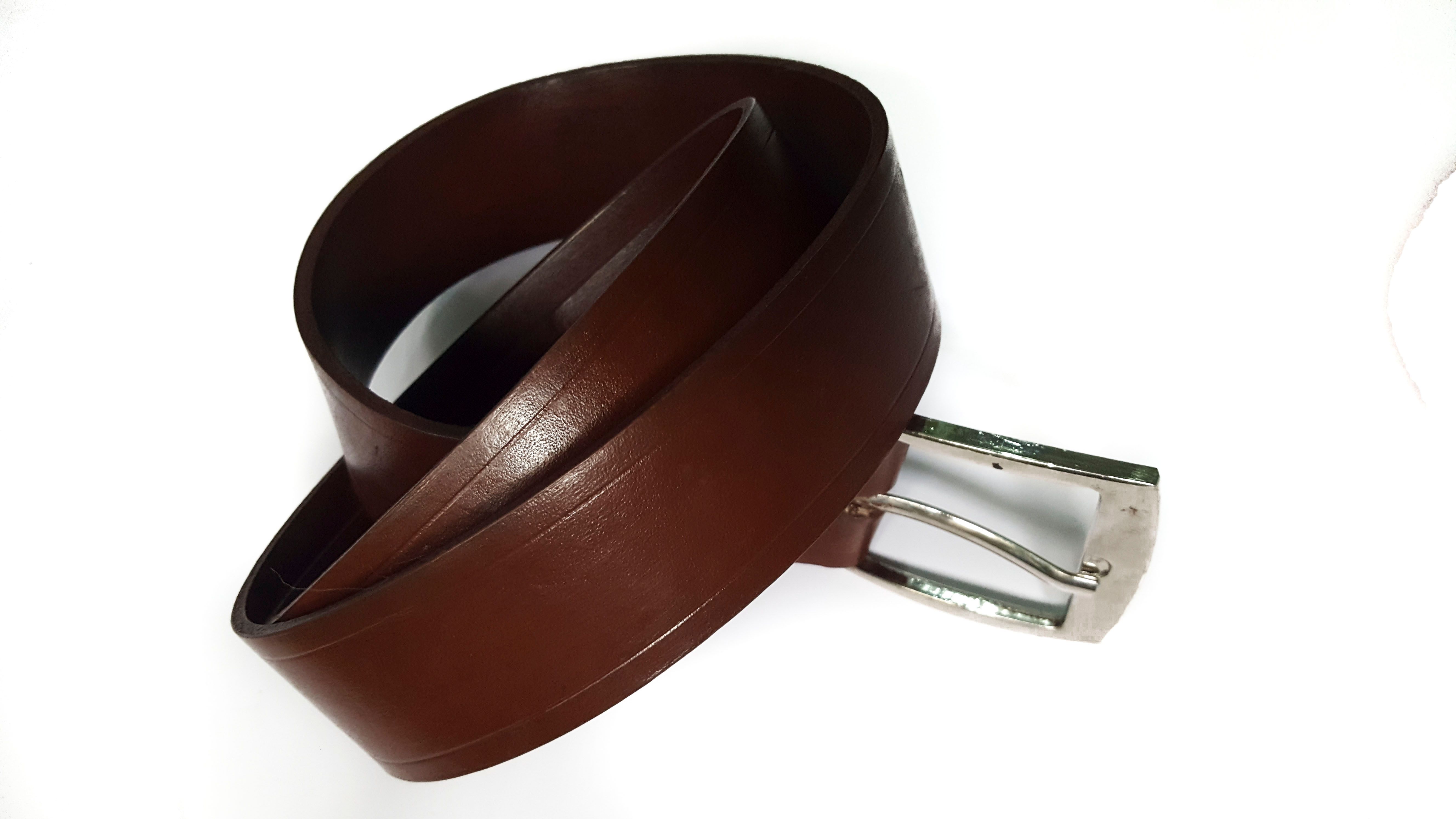 Classic Brown Leather Belt, a testament to timeless elegance and craftsmanship.